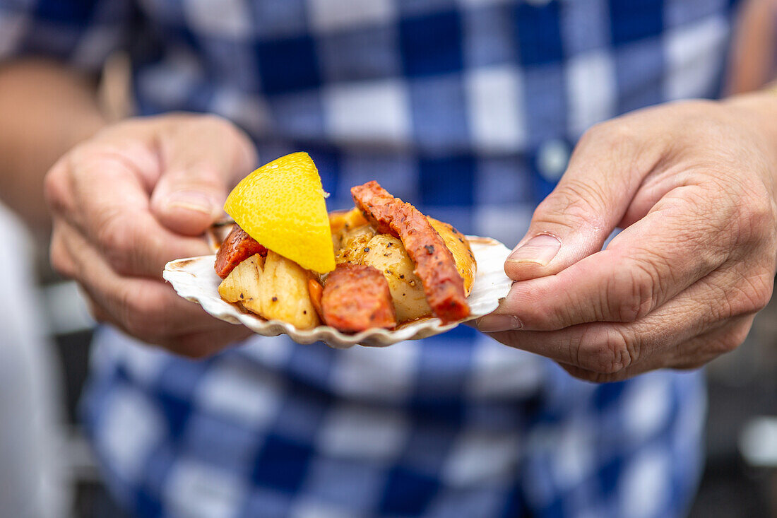 Scallops with chorizo and lemon in a clam shell