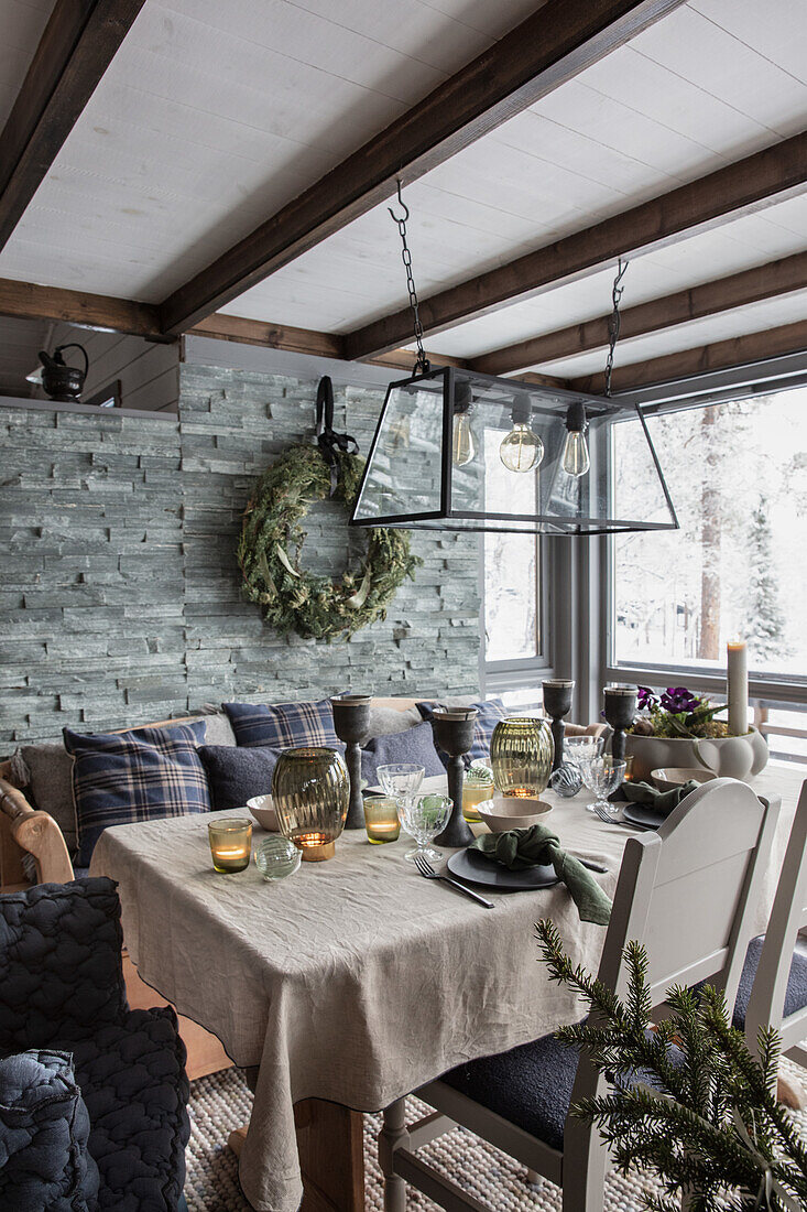 Dining area with Christmas decorations and pendant light