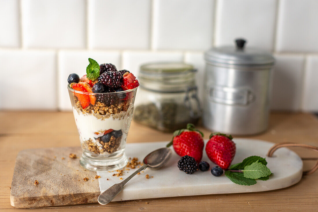 Breakfast trifle with granola, natural yoghurt and berries