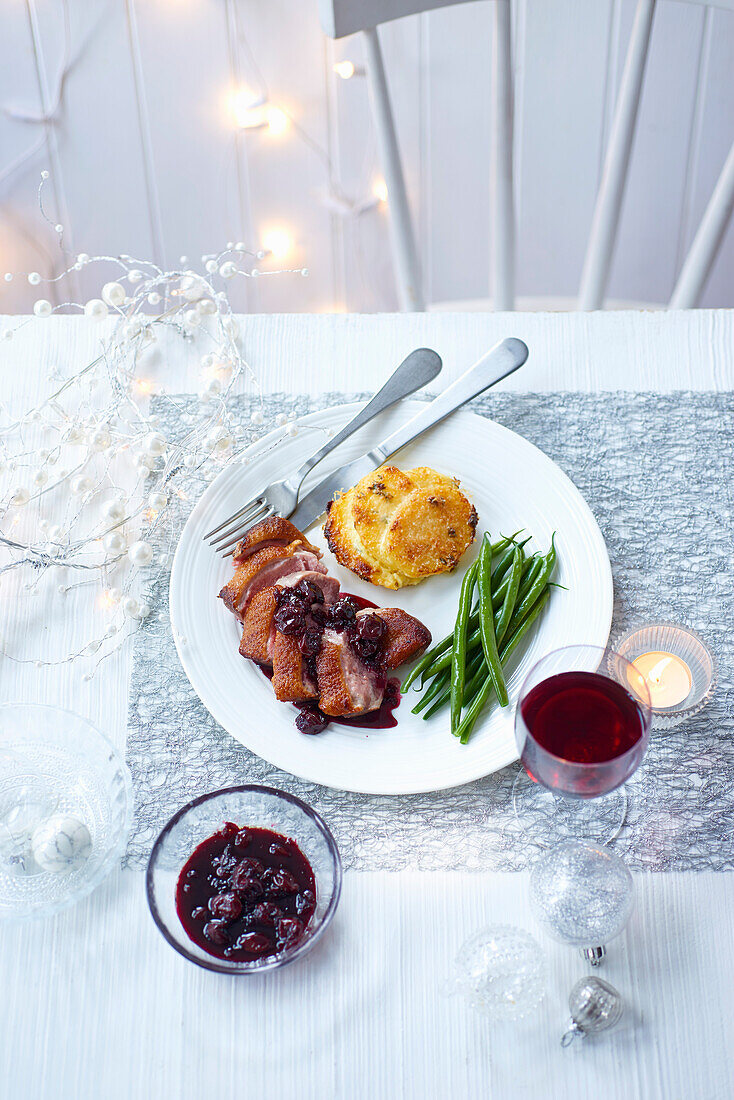 Duck with sour cherry sauce and mini gratin