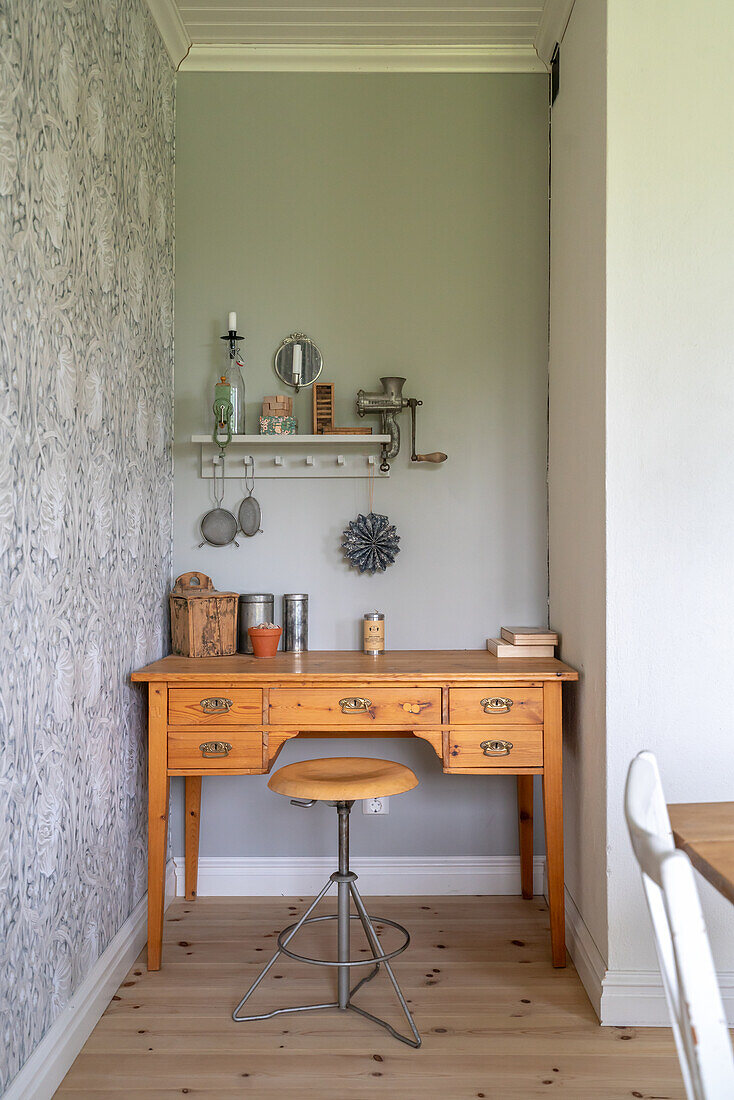 Vintage-style desk with wall shelf and decorative items