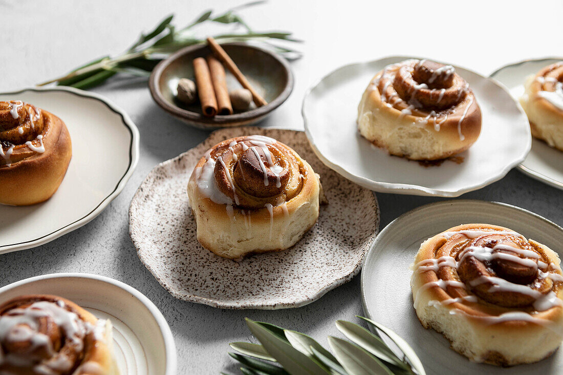 Cinnamon Roll pastries covered in drizzled icing
