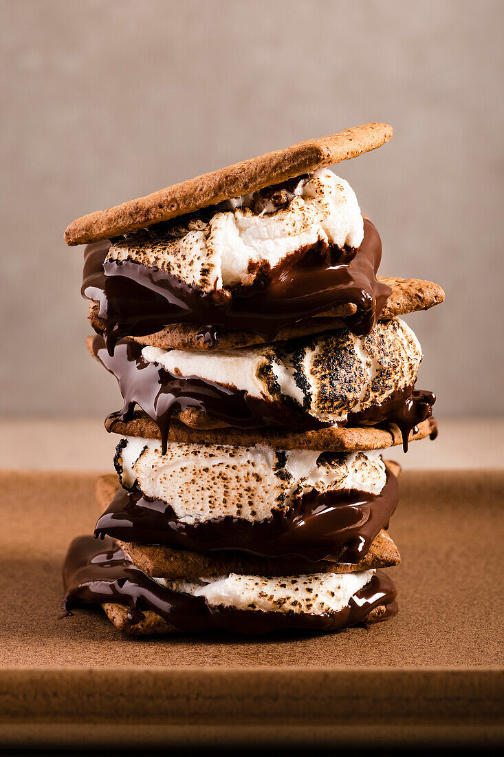 Four gooey s'mores stacked on top of each other
