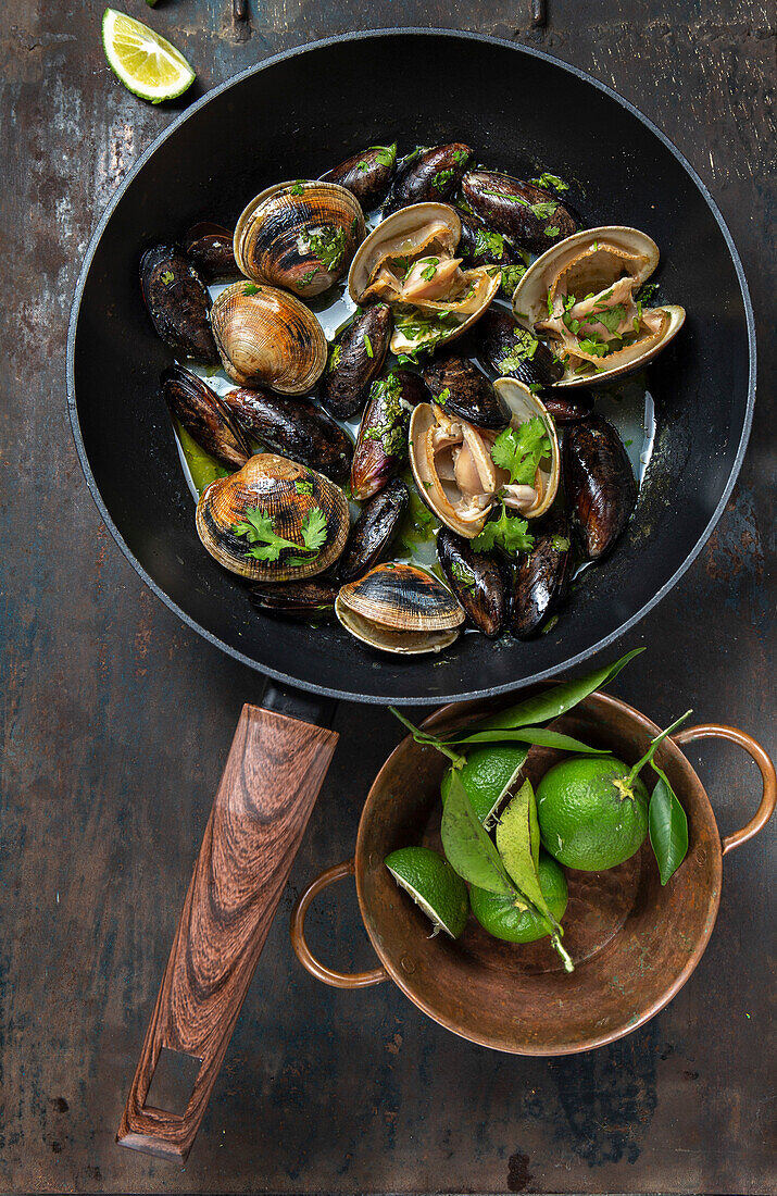 Clams and mussels in pan with beer
