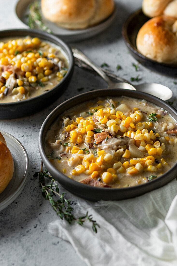 Corn chowder with bread rolls