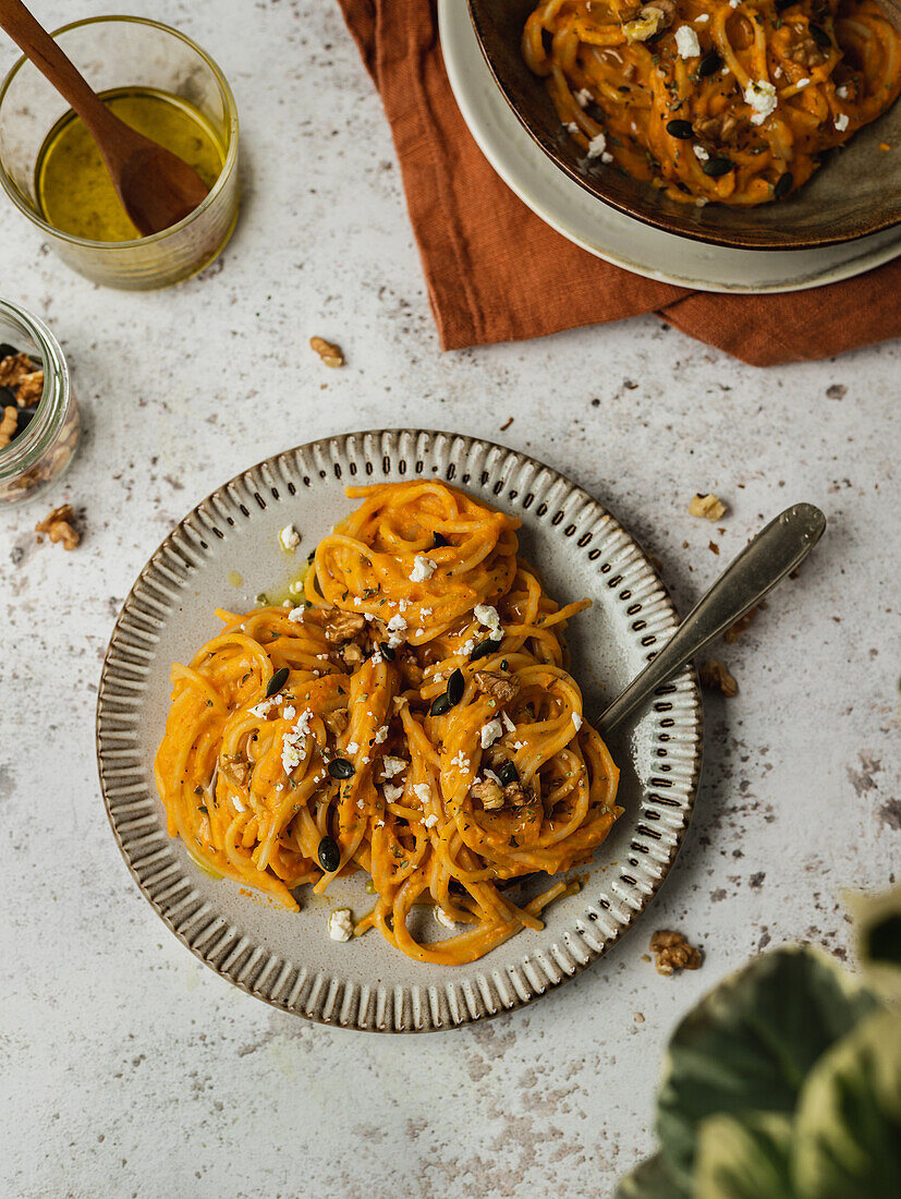 Pumpkin noodles with seeds served on plate of table for lunch