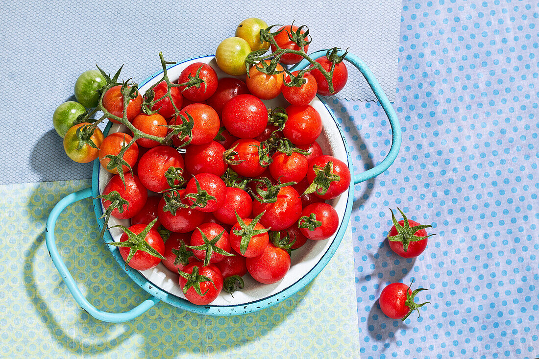 Fresh cherry tomatoes in a colander
