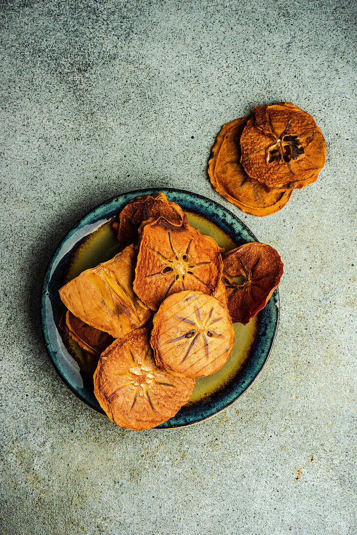 Slices of dried persimmon fruit on the plate