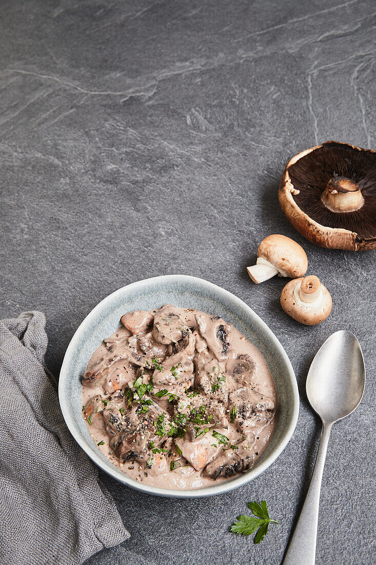 Mushroom dish with vegan cashew cream sauce and parsley