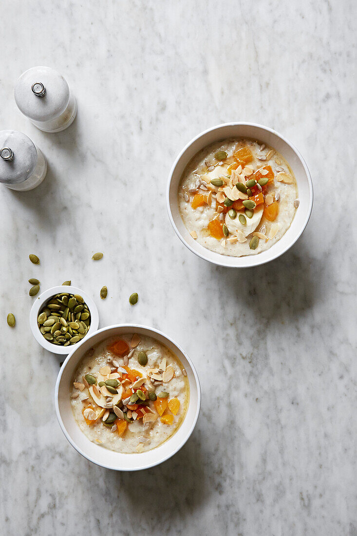Porridge with apricots, flaked almonds and pumpkin seeds
