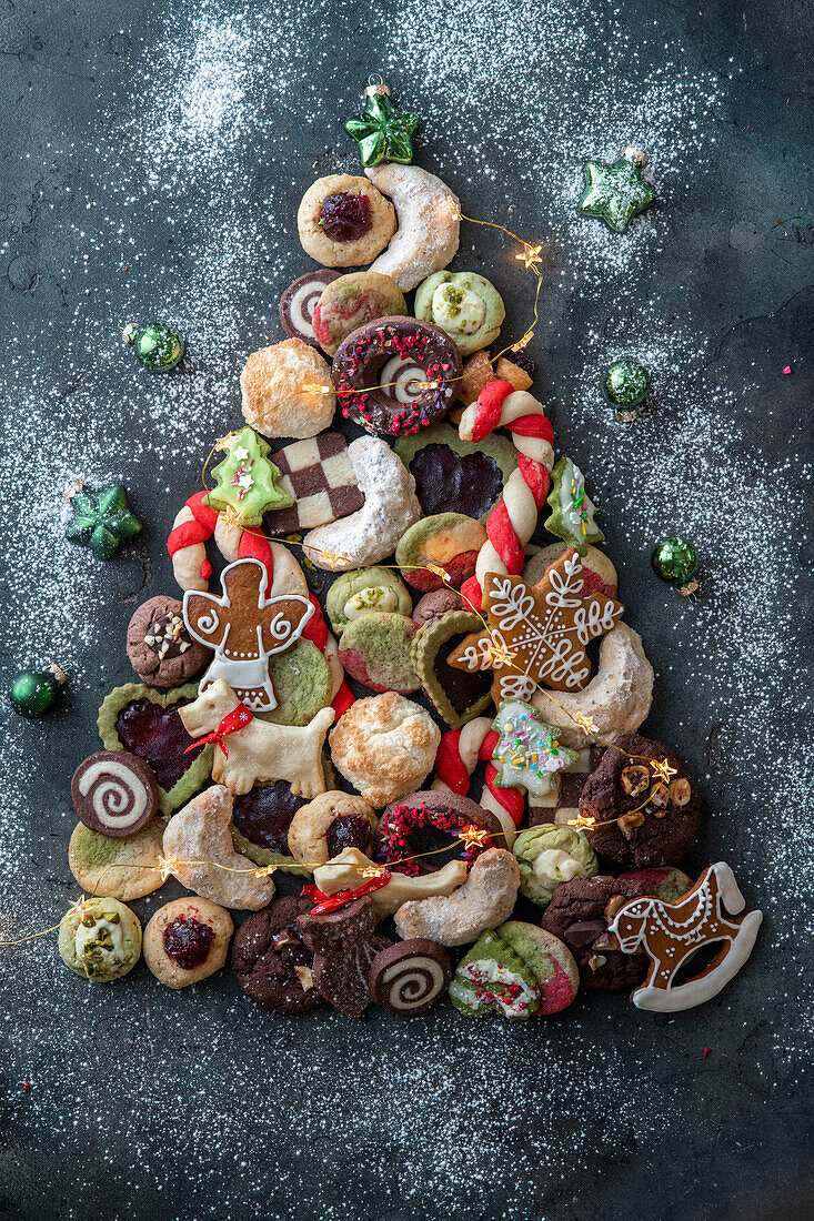 Assorted biscuits arranged in the shape of a Christmas tree
