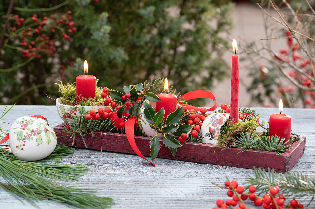 Advent wreath with holly and conifer branches