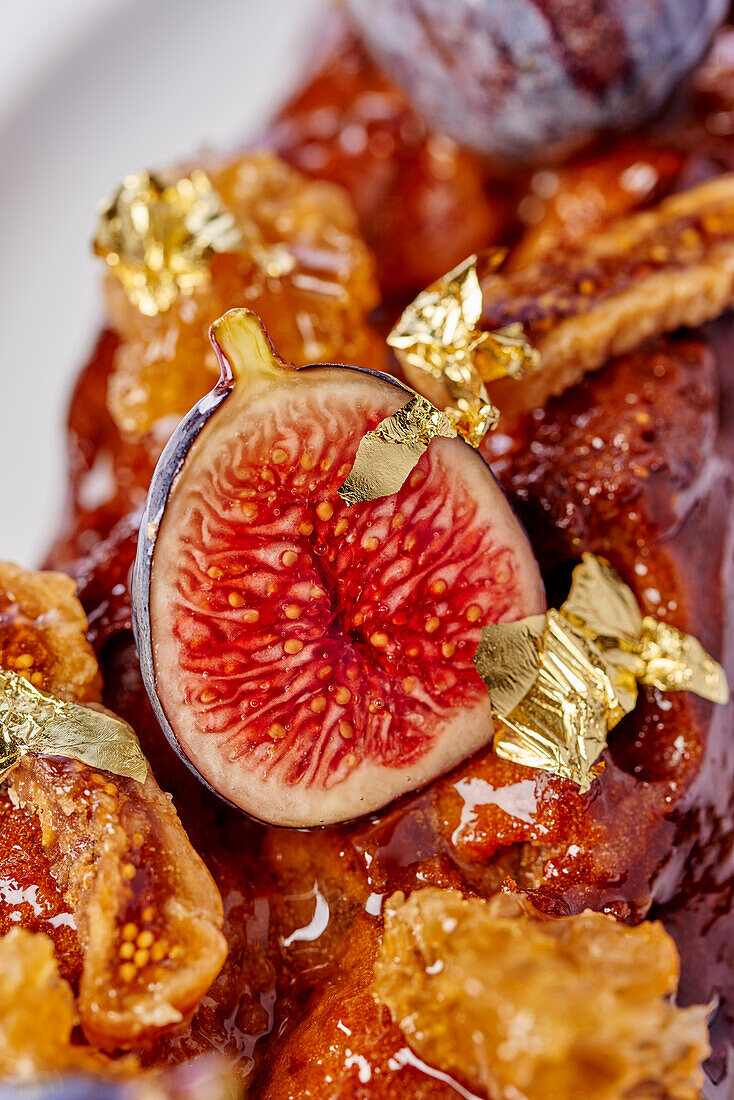 Honey cake with fig and gold leaf (Close Up)