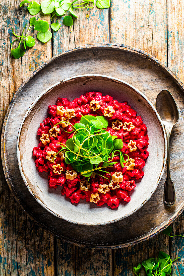 Vegan star pasta with a beet and almond sauce