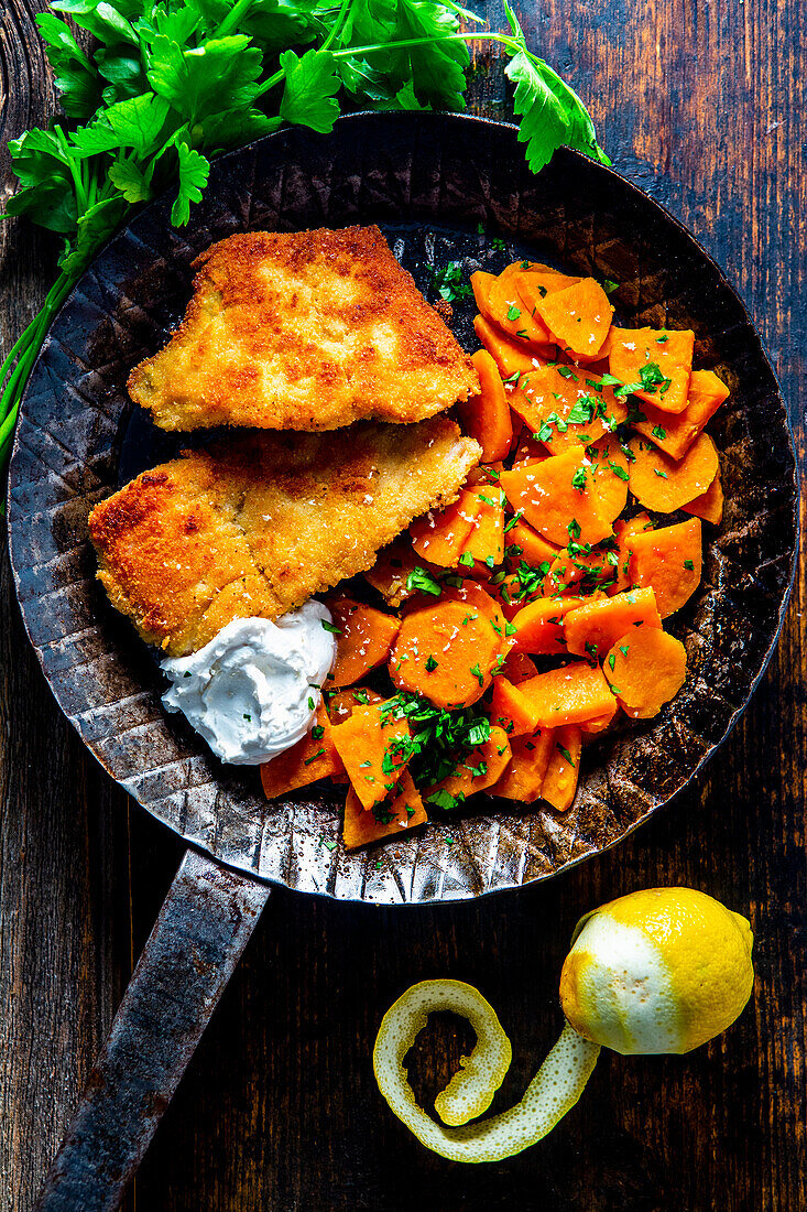 Baked fillet of carp with sweet potatoes and horseradish cream