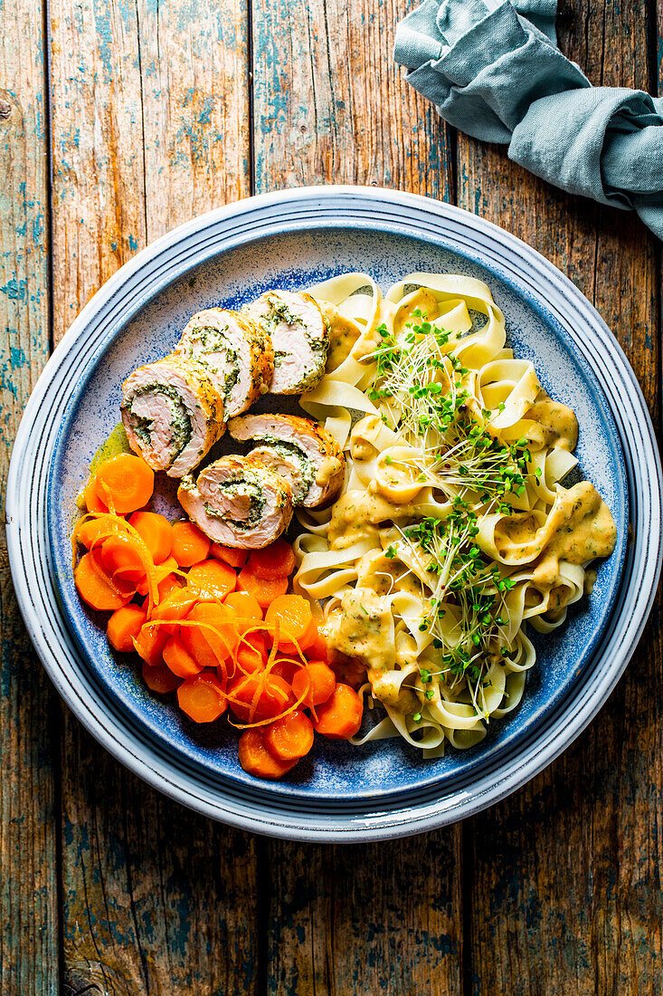 Turkey herb roulade with glazed carrots and tagliatelle