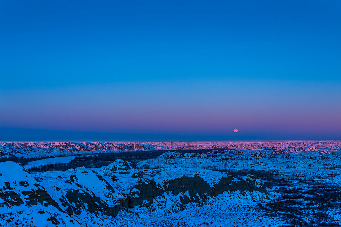 Cold Moon rising over Dinosaur Park, Alberta, Canada