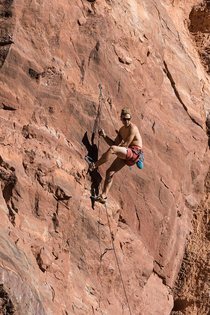 Climber climbing The Theater, Utah, USA