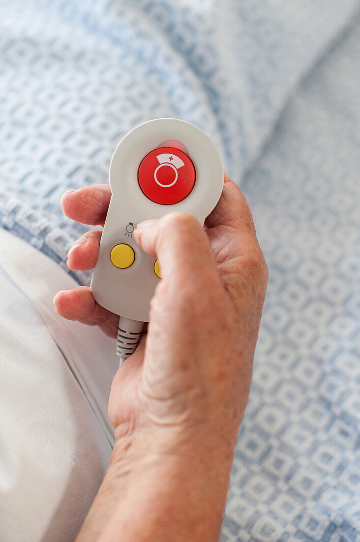 Patient holding alarm button