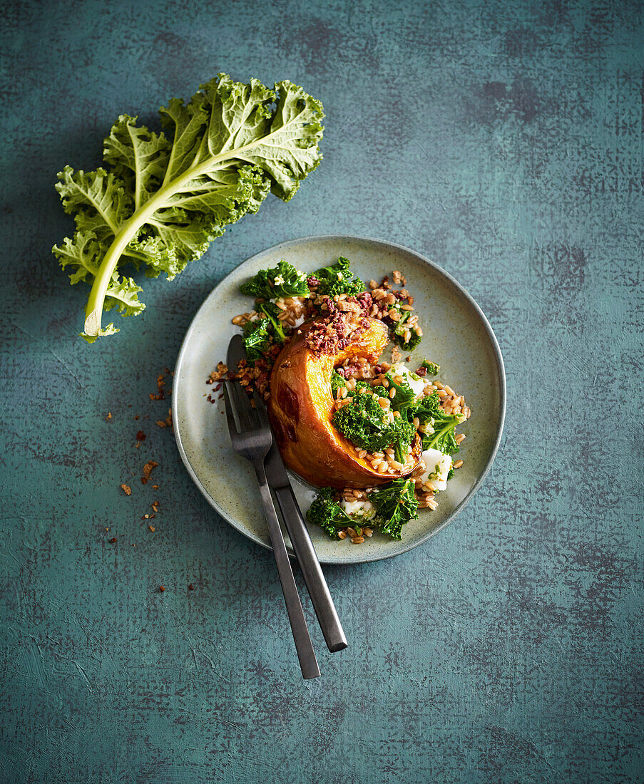 Roasted pumpkin wedges with kale and feta cheese