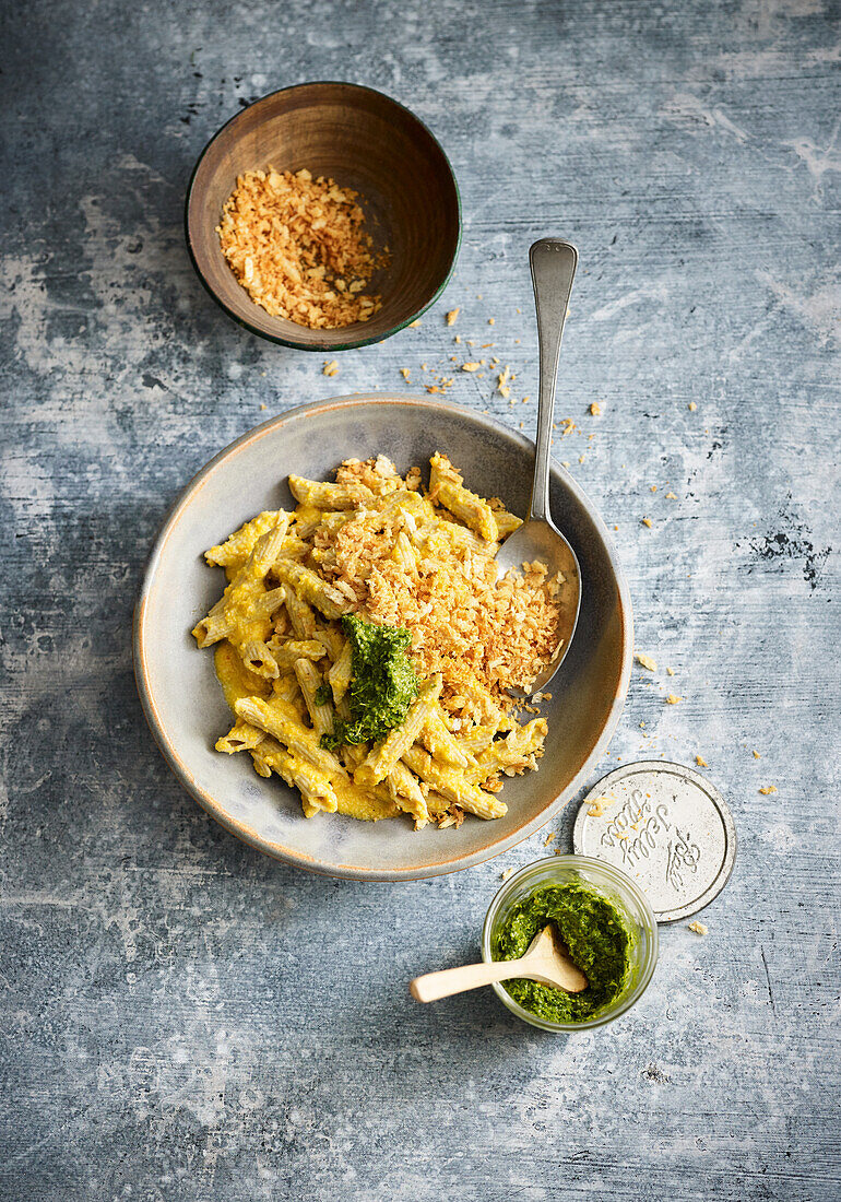 Pasta with carrot sauce and carrot green pesto