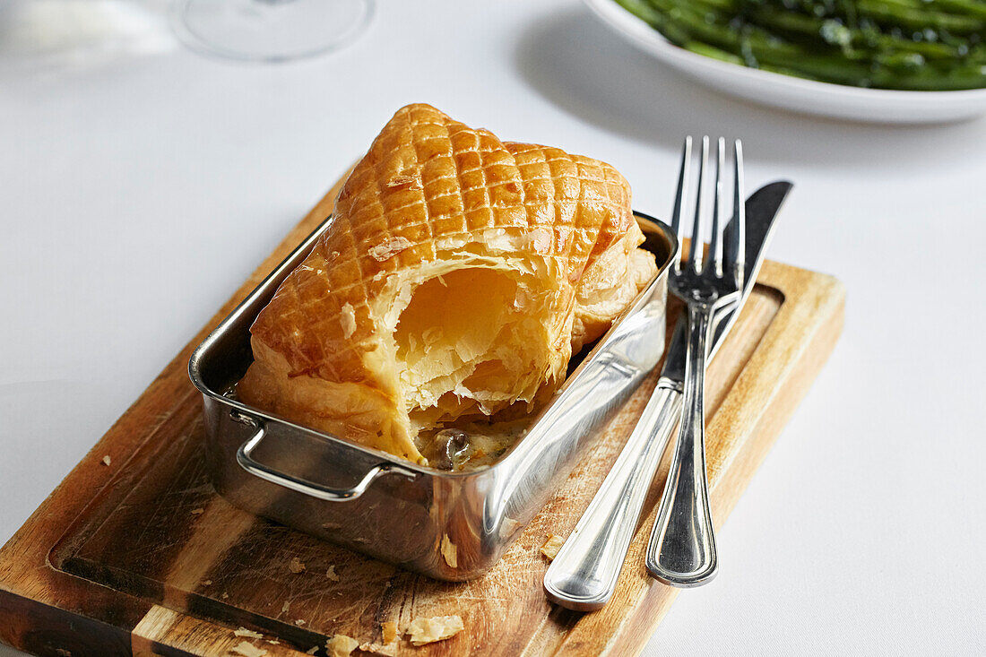 Puff pastry mushroom pie, served with green beans