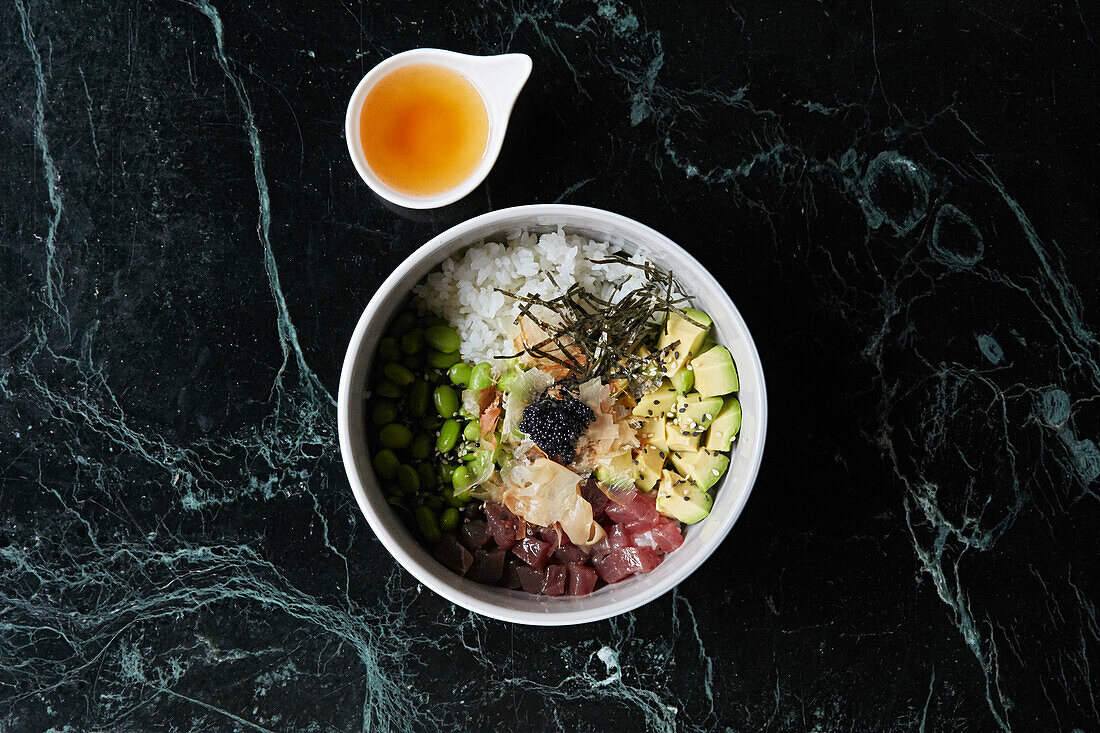 A healthy bowl with tuna, avocado and edamame