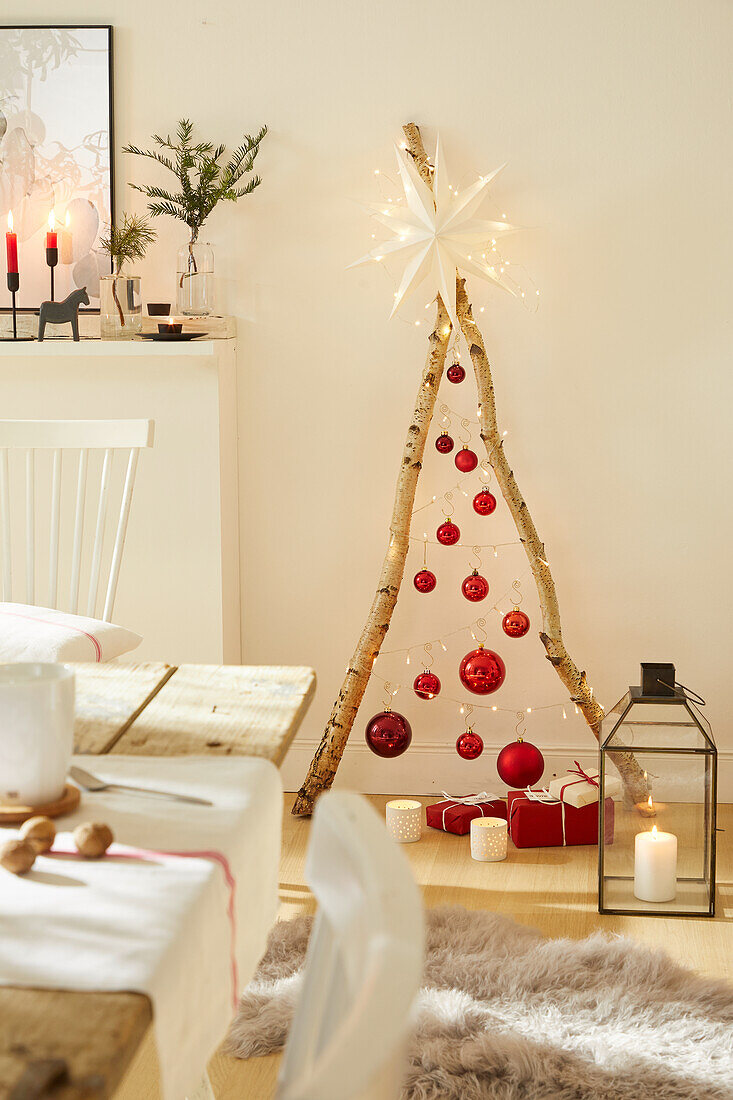 DIY Christmas tree made from branches, Christmas baubles, fairy lights and a star