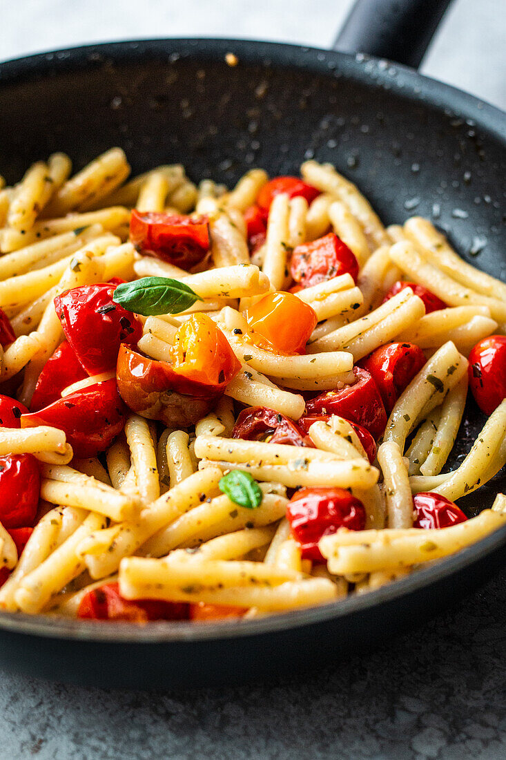 Trofie pasta with herb butter and cherry tomatoes