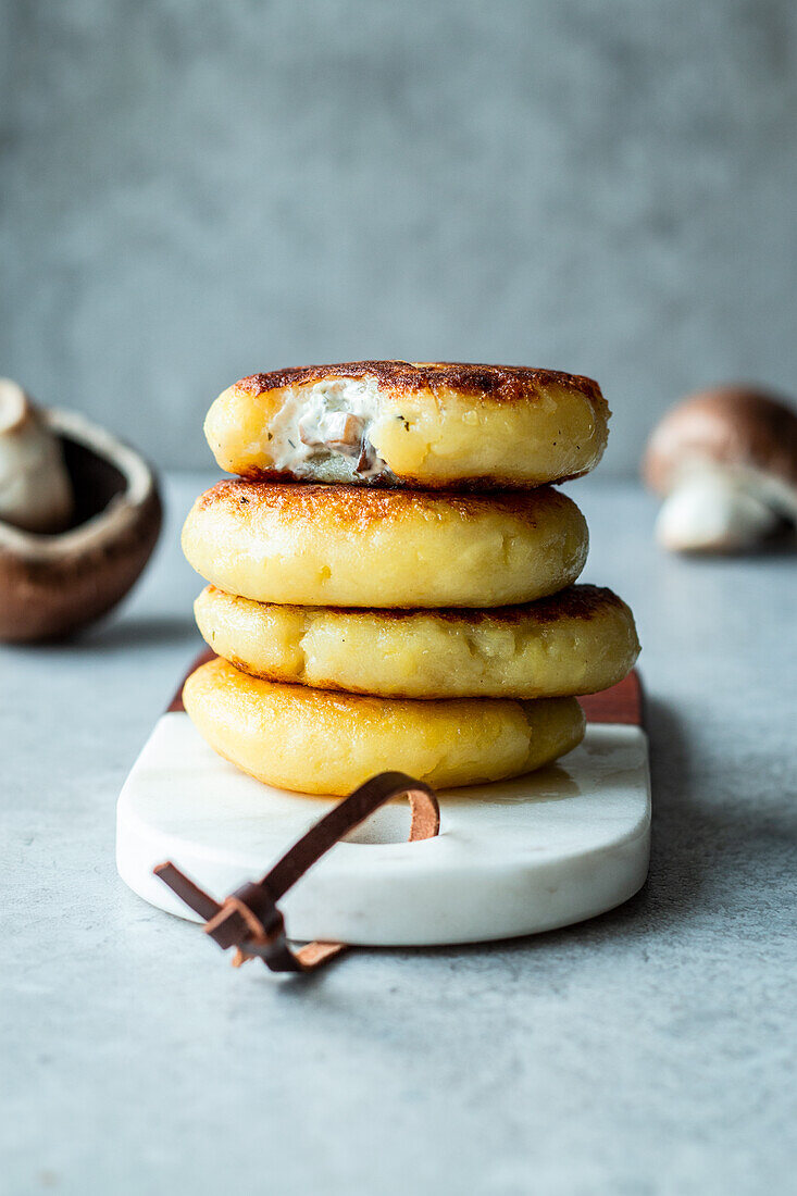 Potato cakes with mushroom and cream cheese filling