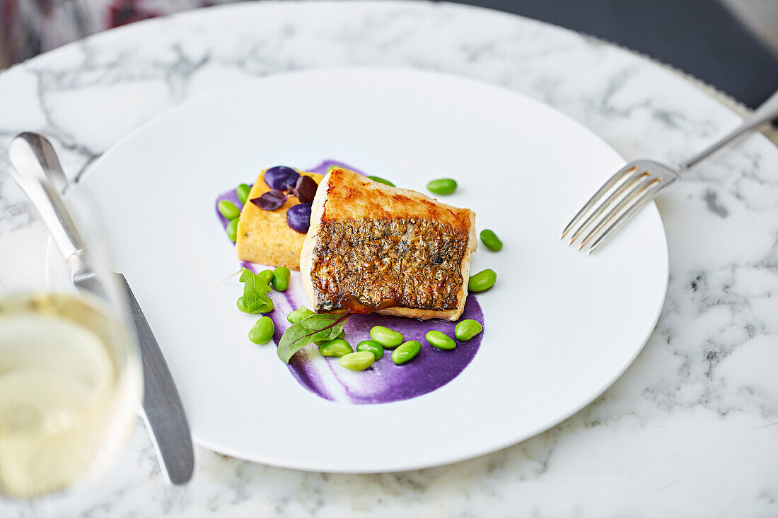 Fillet of fish with polenta and edamame beans