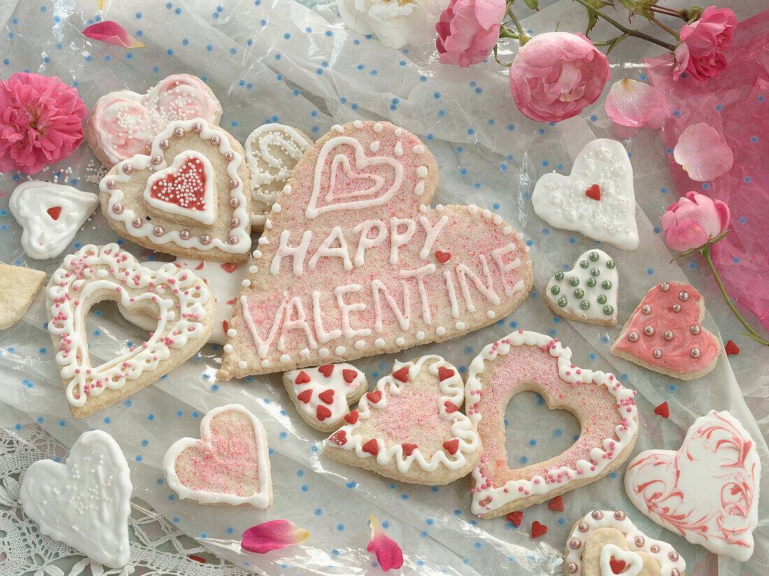 Heart-shaped cookies made of shortbread cookies with sprinkles and royal icing