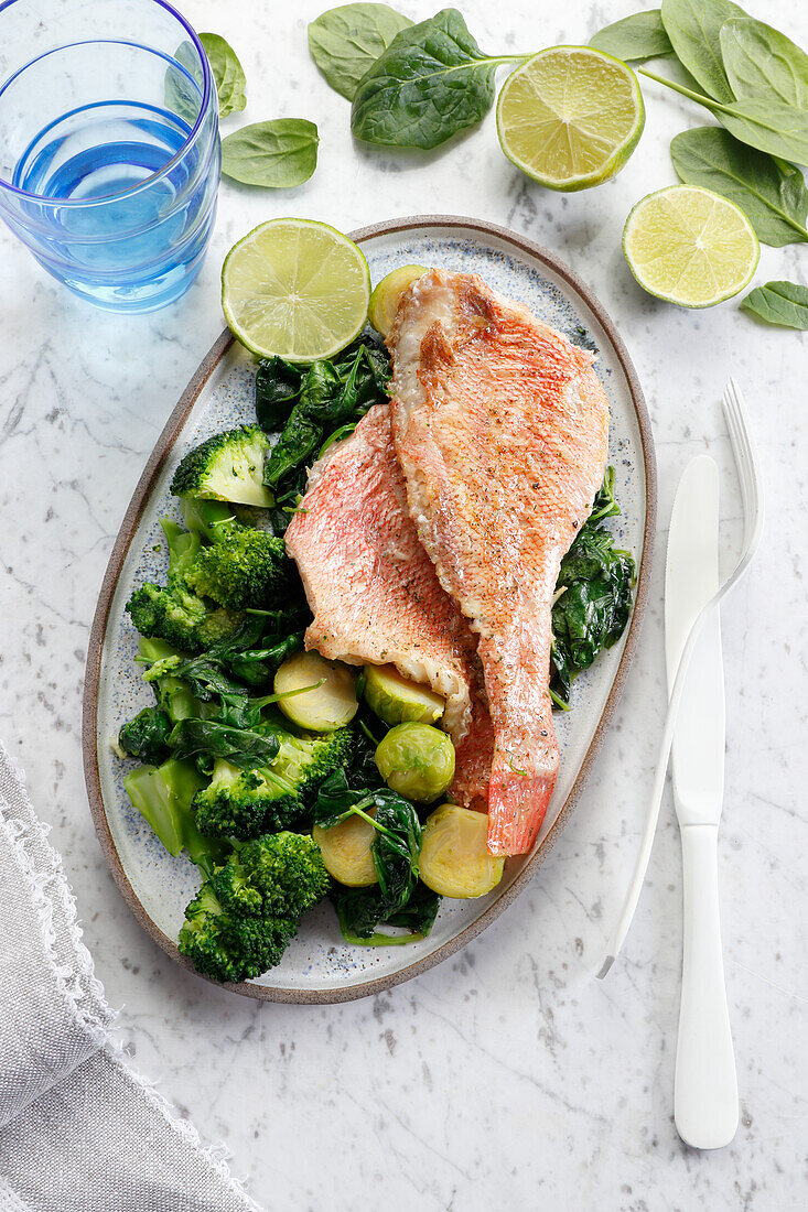 Redfish fillet with broccoli, spinach and Brussels sprouts