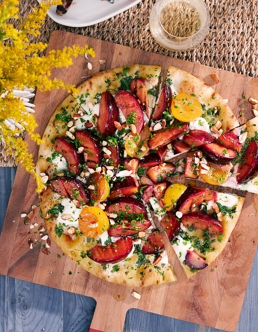 A spicy pizza with plums and apricots