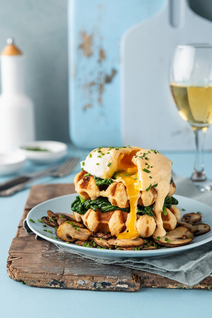 Hearty savory waffles with mushrooms, spinach and poached egg