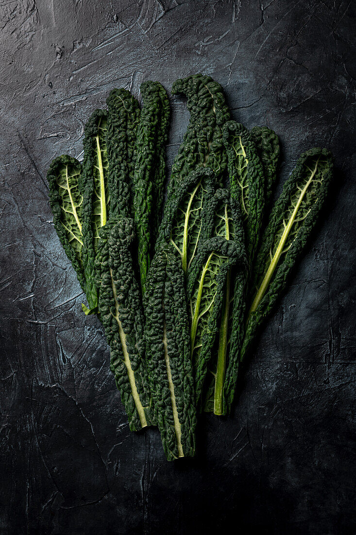 Fresh kale on a black background
