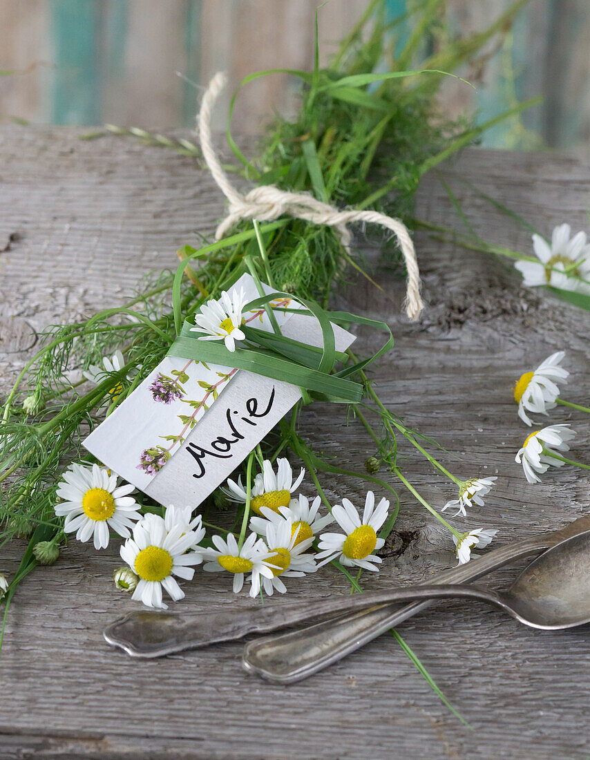 Camomile, name cards and silverware