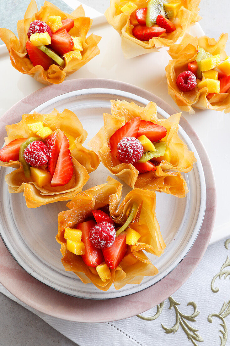 Filo pastry bowls baked in a muffin tin with fruit filling