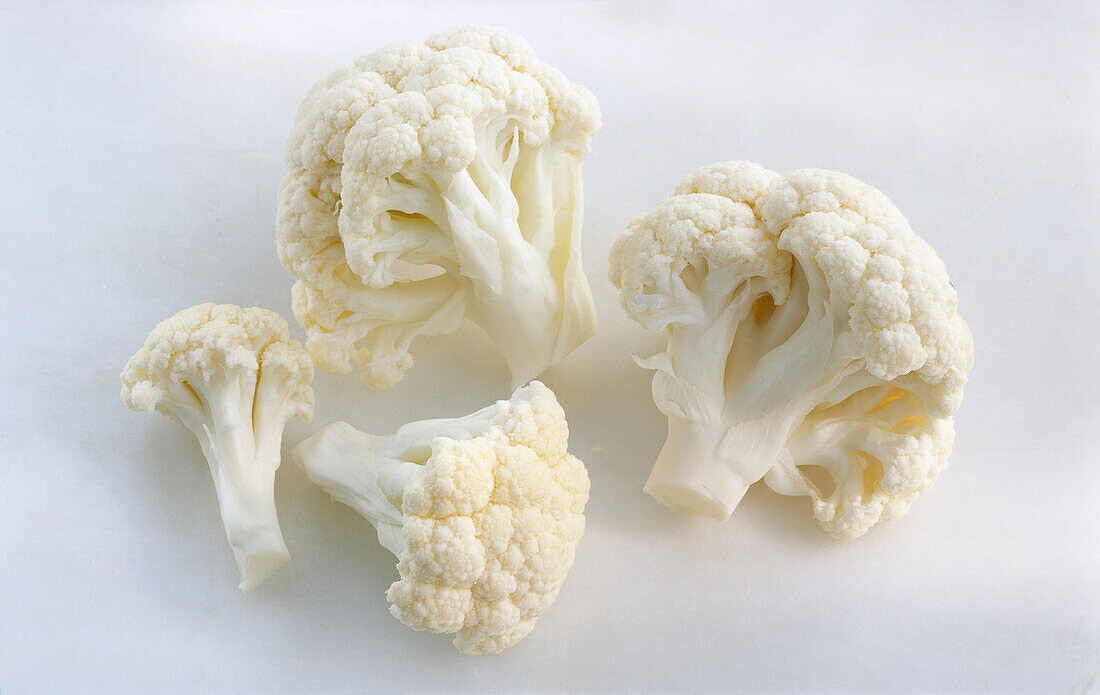 Cauliflower florets on a light background