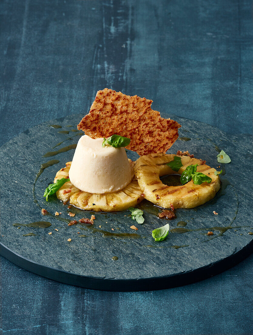 Grilled pineapple with basil, yoghurt parfait and a bacon wafer