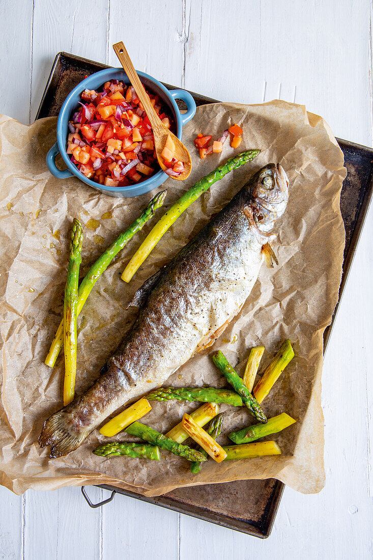 Grilled trout with green asparagus and tomato salsa
