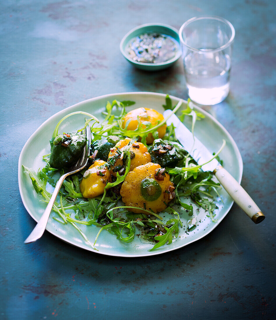 Mini patissons on rocket salad