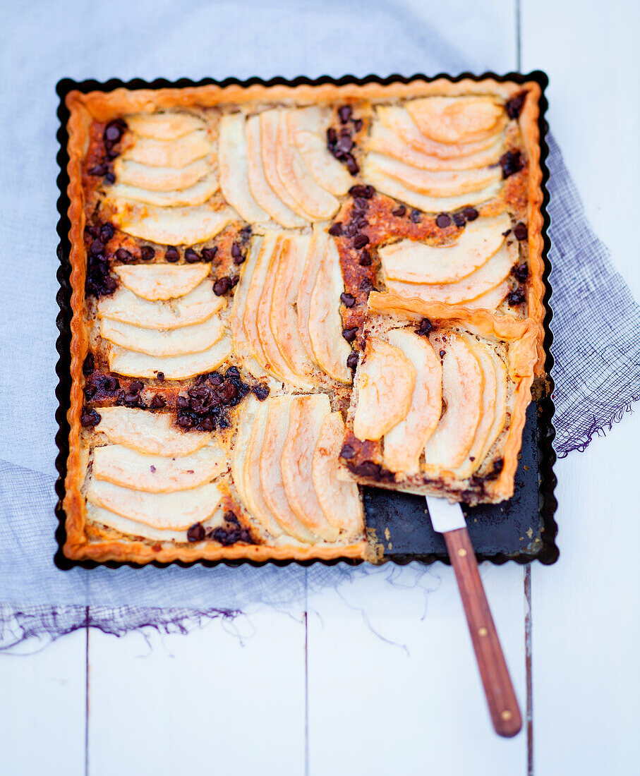 Almond and pear tart on a baking tray