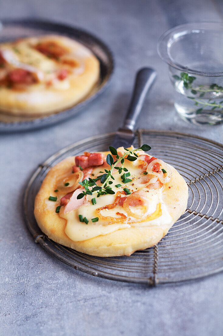 Mini pizza with cheese and bacon