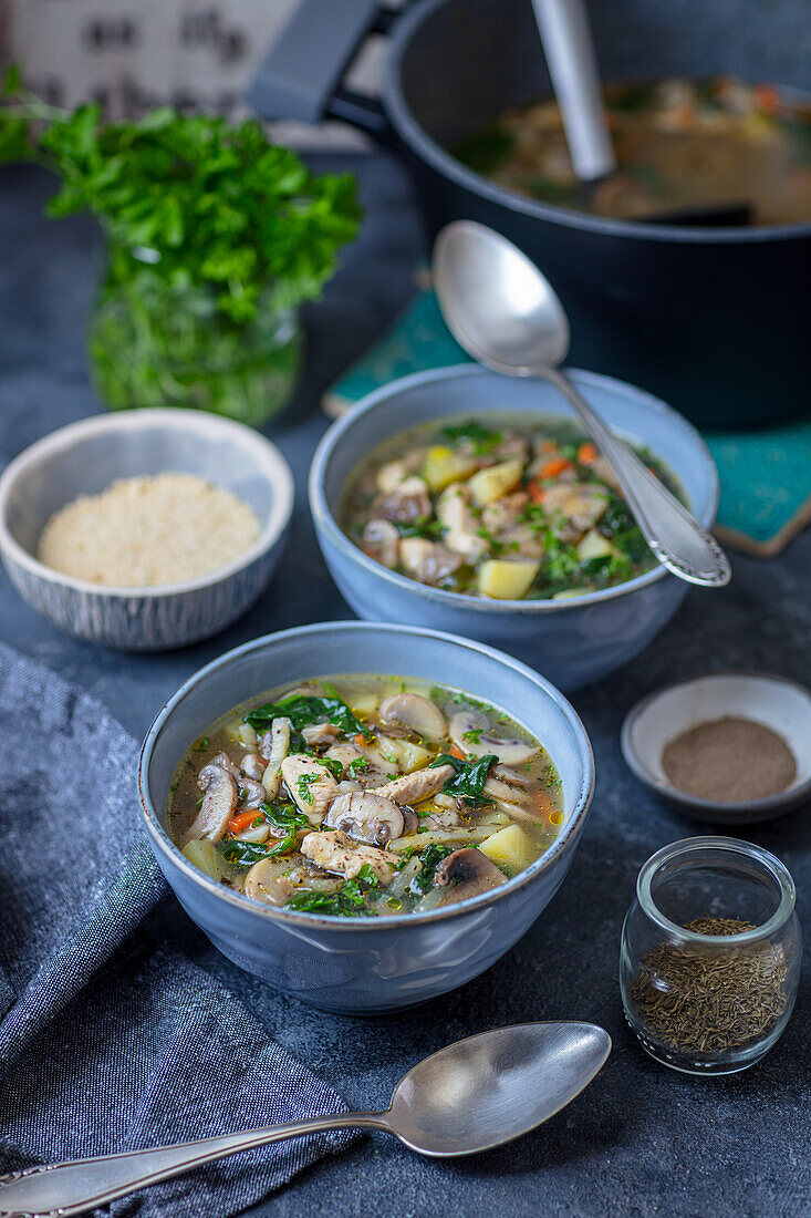 Potato soup with mushrooms, turkey and spinach