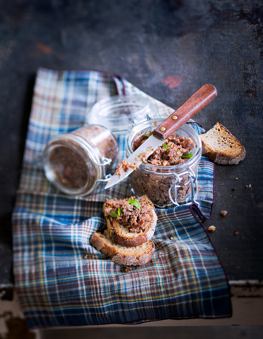 Wild boar rillettes in a jar and on country bread