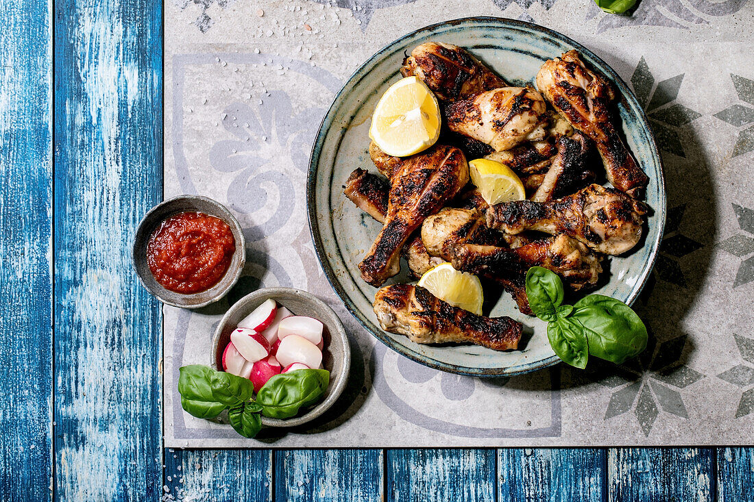 Grilled chicken thighs with sauce and fresh radish