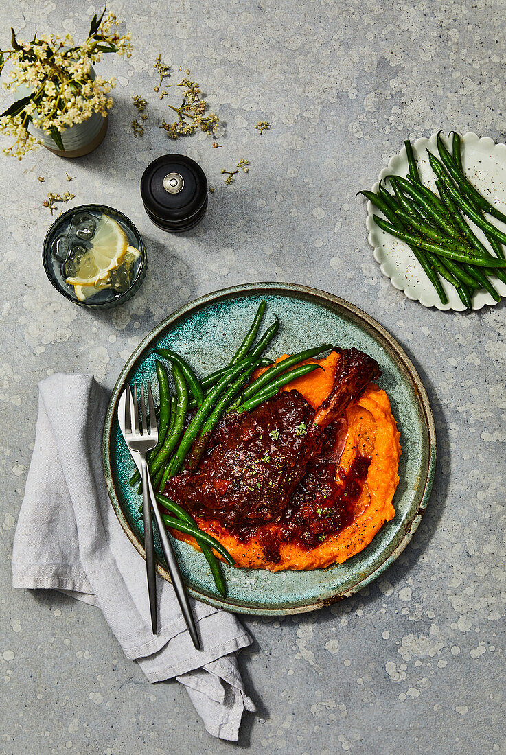 Leg of lamb with sweet potato puree and green beans