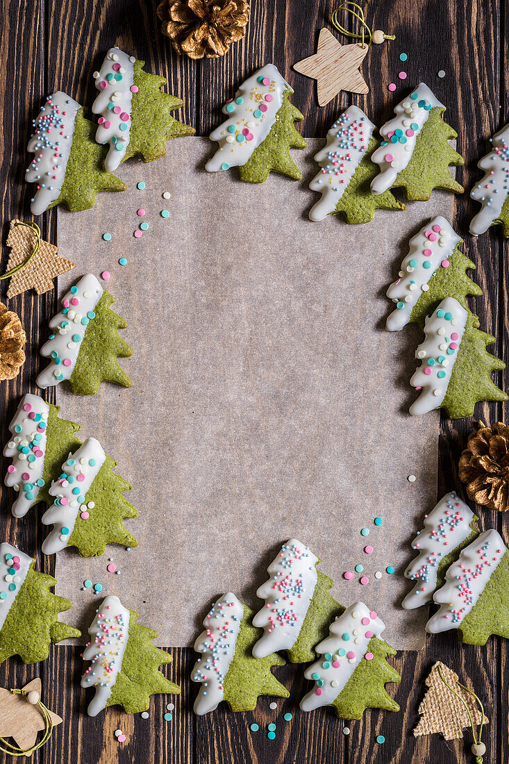 Christmas green matcha tea butter cookies with white chocolate glaze and hundreds and thousands sprinkles