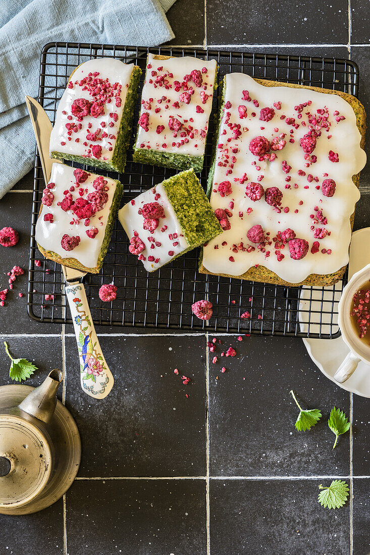 Nettle cake with sugar icing and frozen raspberries